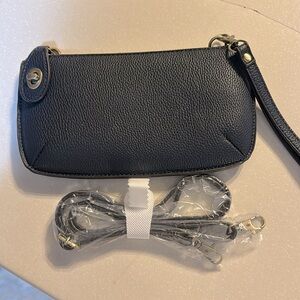Blue clutch with shoulder strap perfect to hold phone, keys, money.  Lightweight